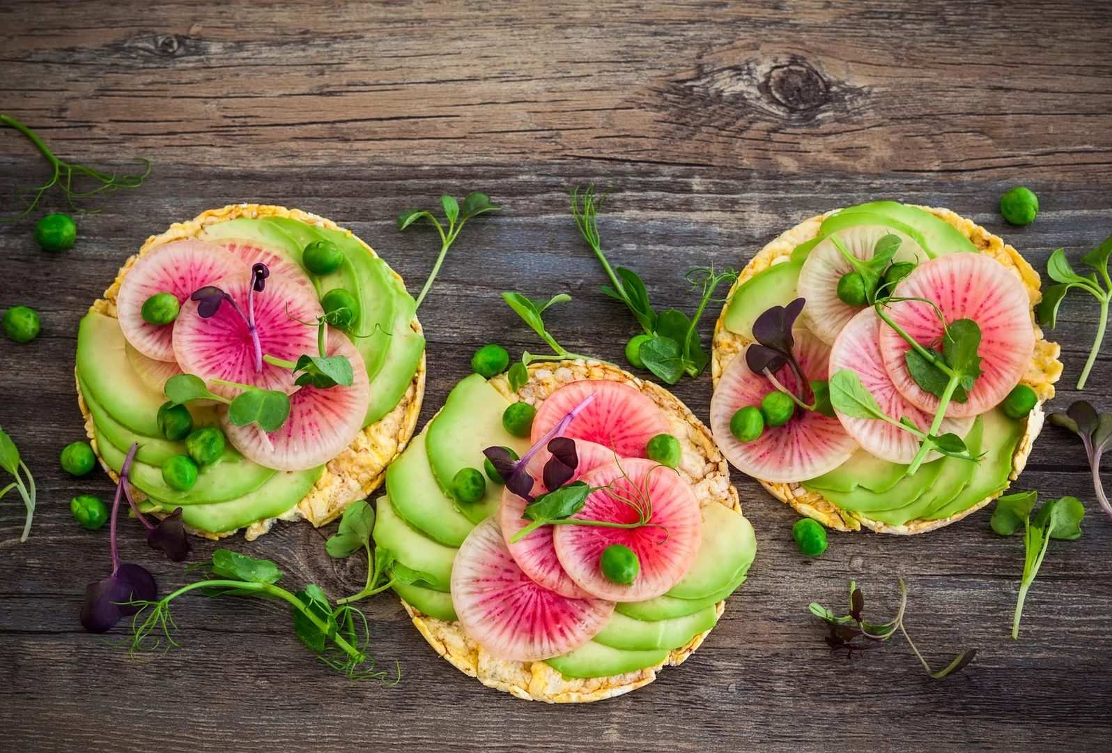 KOYO rice cakes with avocado, radish, and greens
